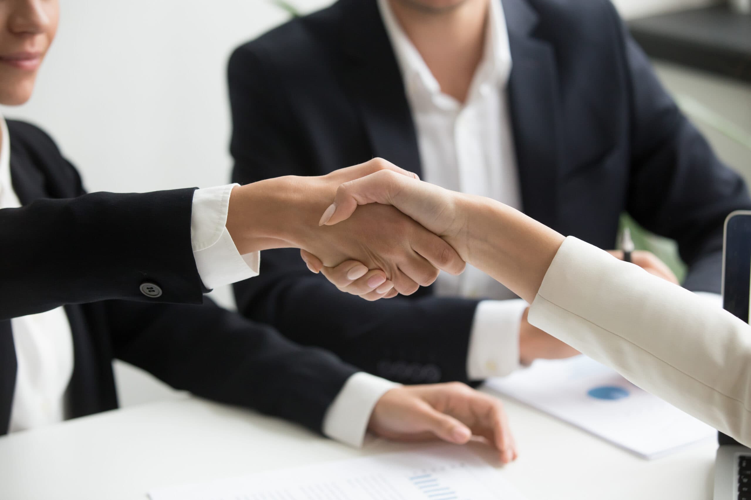 Employer and NJB consultant shaking hands after a recruitment agreement